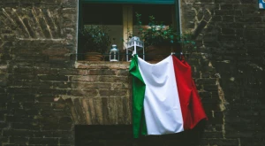Italian flag hanging from a balcony