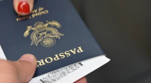 A closed Italian passport on a flat surface