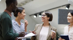 Group of workers talking in a professional setting