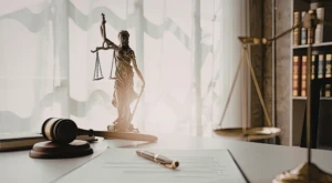 Small sculpture of Justice holding scales and a sword