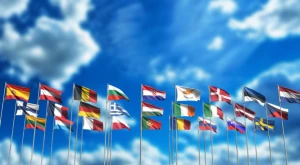 Flags of the European Union waving against a clear sky