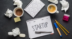 Entrepreneur’s desk with a laptop and work documents