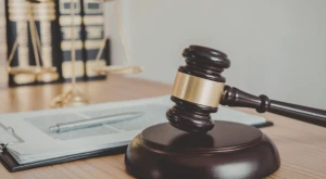 Judicial gavel of the Italian Constitutional Court on a wooden table